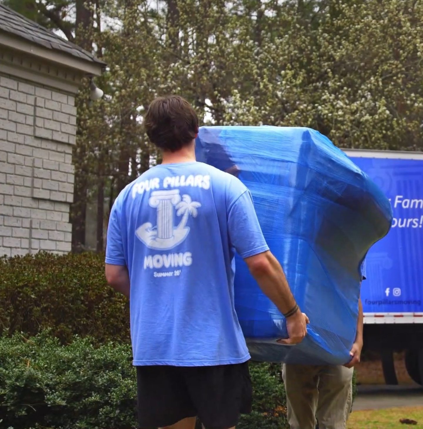 Four Pillars Moving crew handling a local move